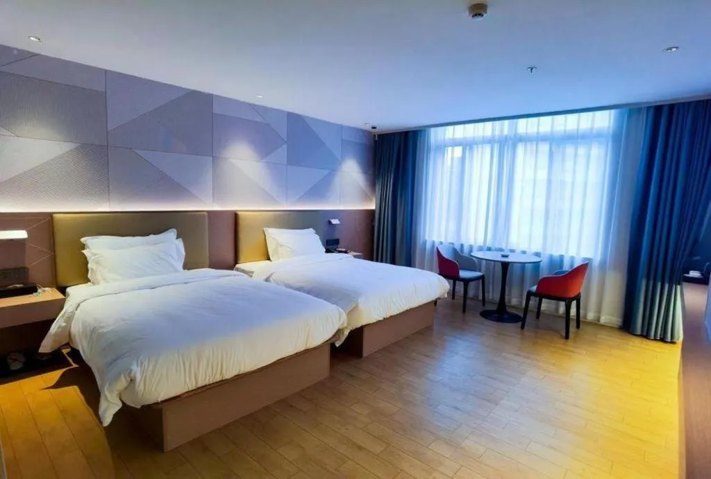 Bed in Borrman Hotel Shaoguan Century East Street Fengcai Building