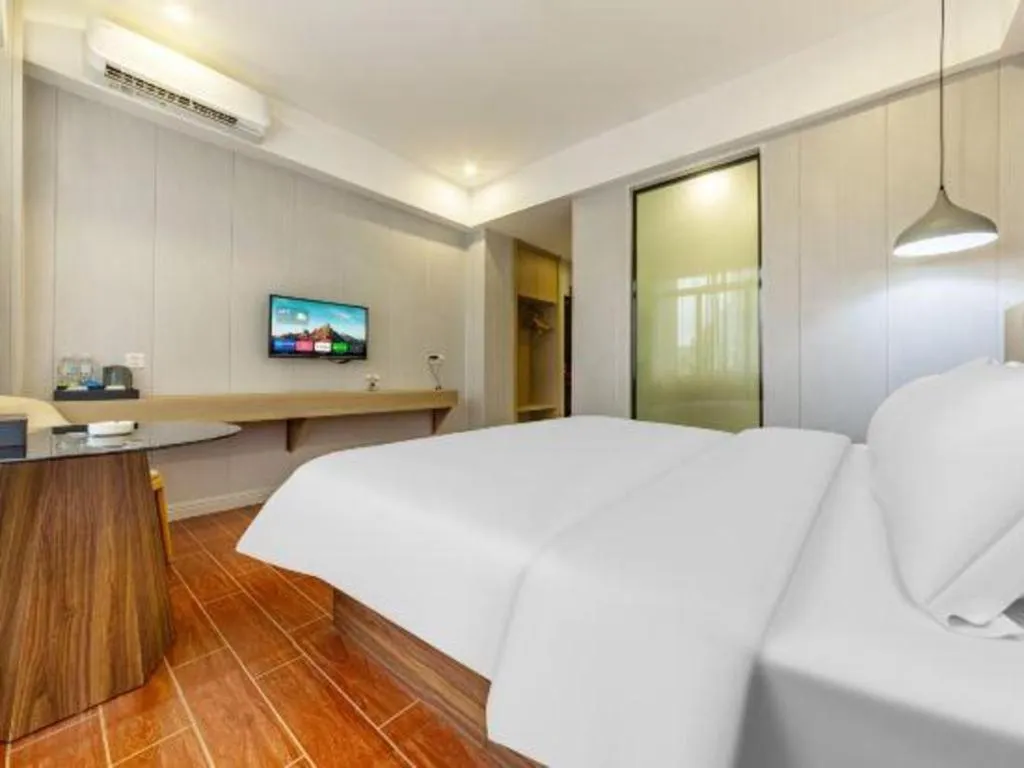 Bed in Borrman Hotel Shaoguan Century East Street Fengcai Building