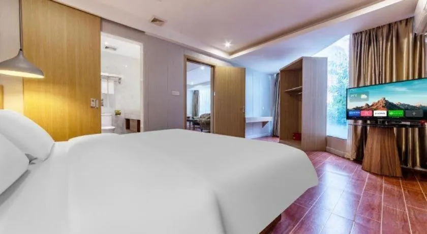 Bed in Borrman Hotel Shaoguan Century East Street Fengcai Building