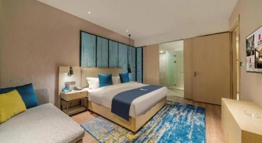 Bed in Echarm Hotel Foshan Jiaokou Metro Station Jiazhou Plaza