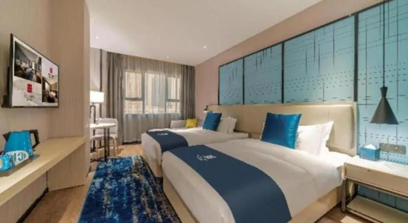 Bed in Echarm Hotel Foshan Jiaokou Metro Station Jiazhou Plaza