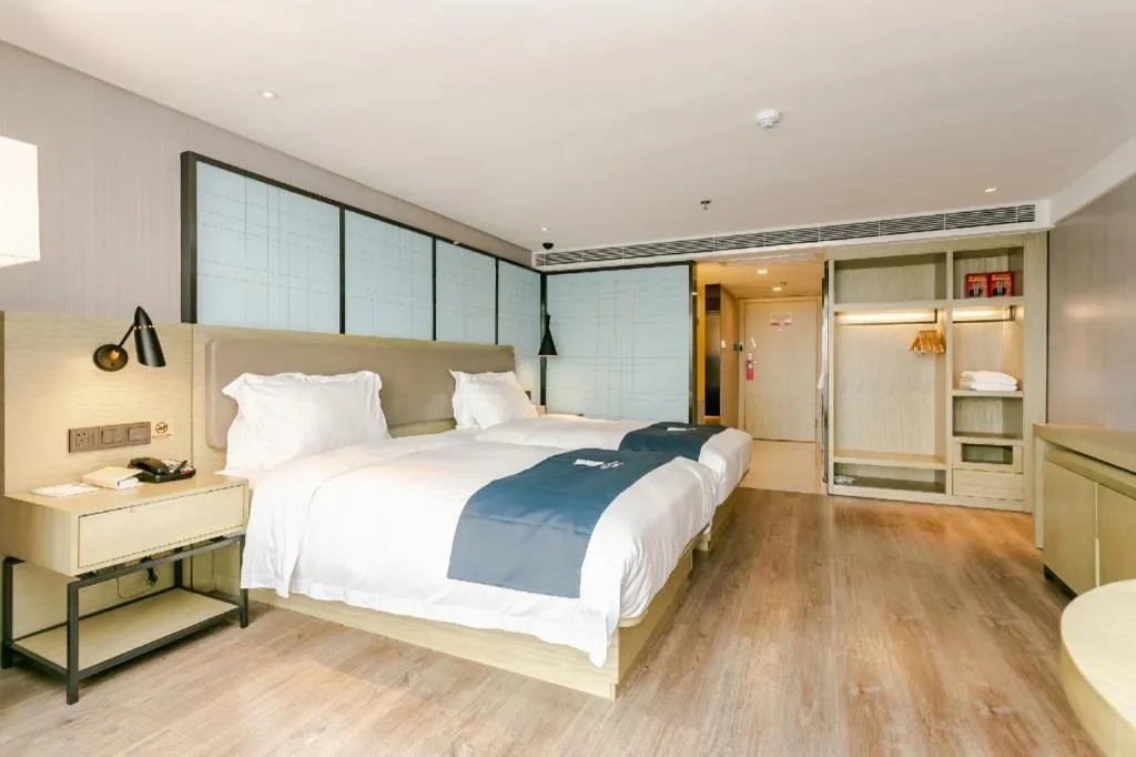 Bed in Echarm Hotel Guiyang North High-speed Railway Station