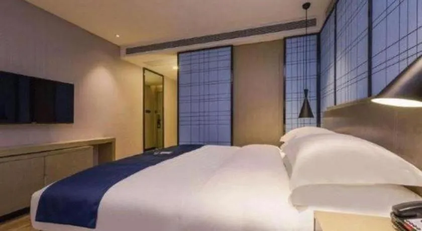 Bed in Echarm Hotel Guiyang North High-speed Railway Station