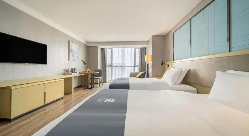 Bed in Echarm Hotel Guiyang North High-speed Railway Station