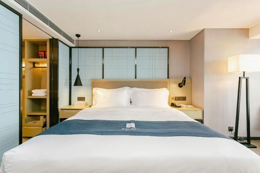 Bed in Echarm Hotel Guiyang North High-speed Railway Station