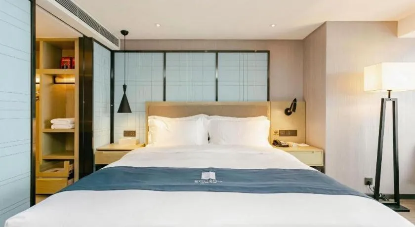 Bed in Echarm Hotel Guiyang North High-speed Railway Station