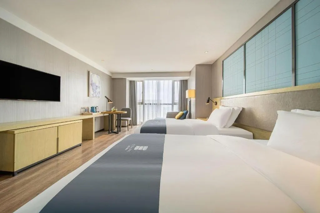 Bed in Echarm Hotel Guiyang North High-speed Railway Station