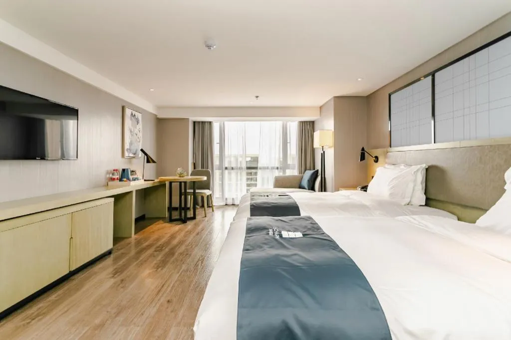 Bed in Echarm Hotel Guiyang North High-speed Railway Station