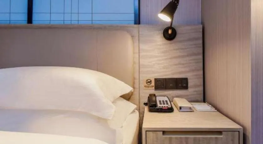 Bed in Echarm Hotel Guiyang North High-speed Railway Station