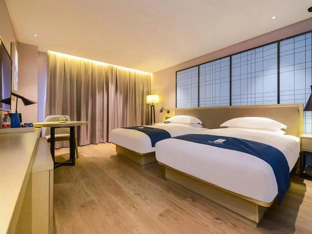 Bed in Echarm Hotel Guiyang North High-speed Railway Station
