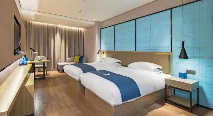 Bed in Echarm Hotel Guilin Railway Station the MixC