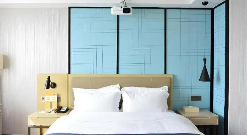 Bed in Echarm Hotel Tai'an Taishan Tianwai Village Hongmen