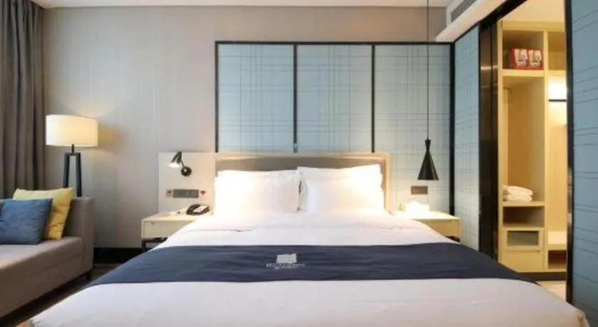 Bed in Echarm Hotel Tai'an Taishan Tianwai Village Hongmen