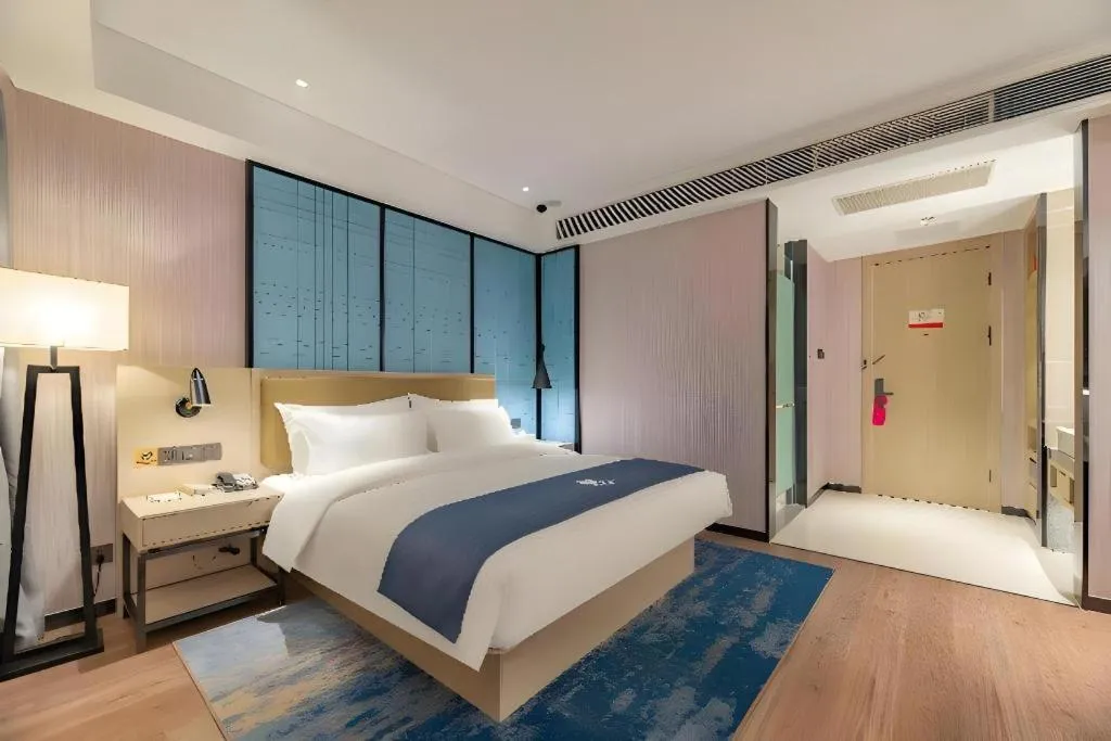 Bed in Echarm Hotel Tai'an Taishan Tianwai Village Hongmen