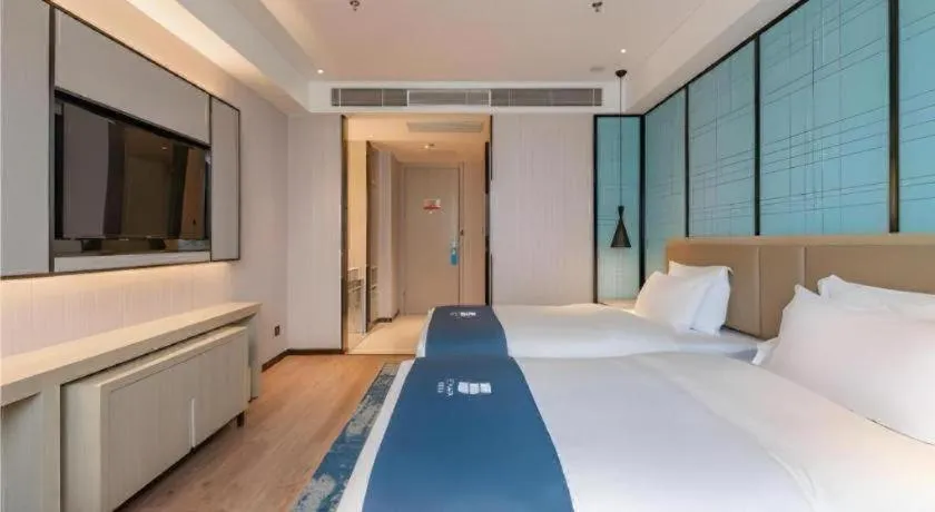 Bed in Echarm Hotel Tai'an Taishan Tianwai Village Hongmen