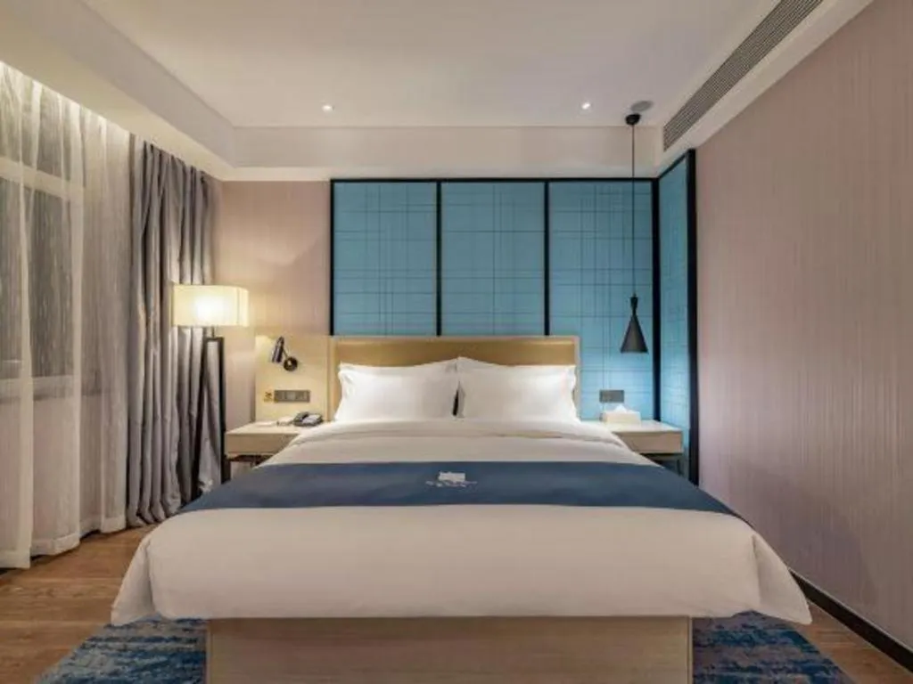 Bed in Echarm Hotel Tai'an Taishan Tianwai Village Hongmen