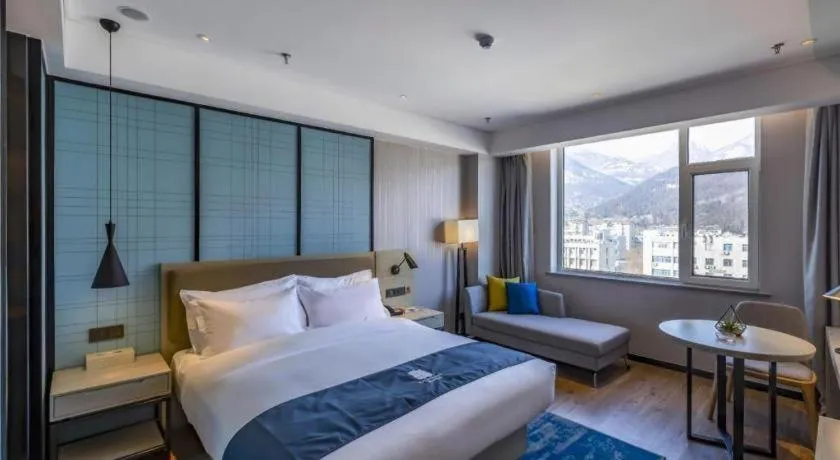 Bed in Echarm Hotel Tai'an Taishan Tianwai Village Hongmen