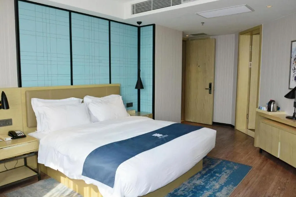 Bed in Echarm Hotel Tai'an Taishan Tianwai Village Hongmen