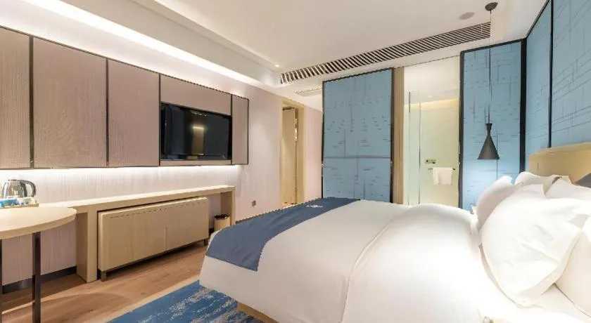 Bed in Echarm Hotel Tai'an Taishan Tianwai Village Hongmen