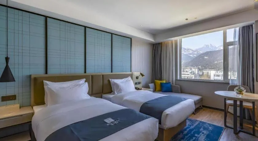 Bed in Echarm Hotel Tai'an Taishan Tianwai Village Hongmen