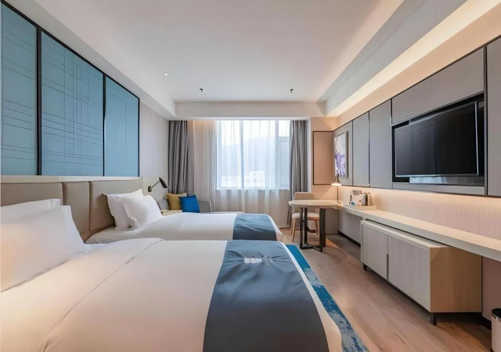 Bed in Echarm Hotel Tai'an Taishan Tianwai Village Hongmen