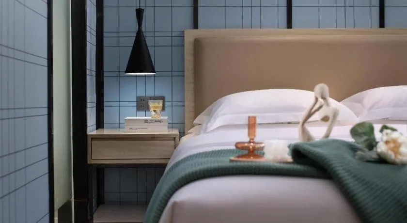 Bed in Echarm Hotel Tai'an Taishan Tianwai Village Hongmen