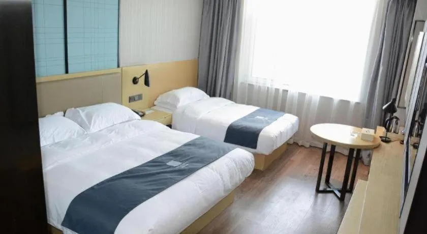 Bed in Echarm Hotel Tai'an Taishan Tianwai Village Hongmen