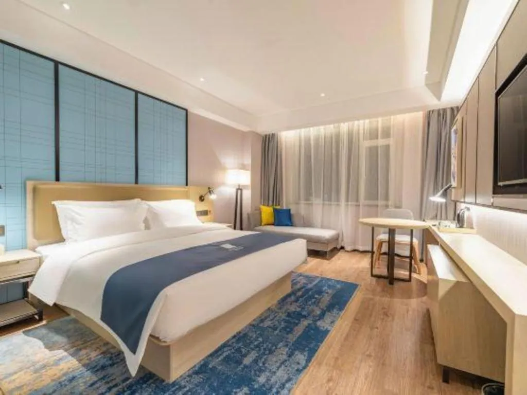 Bed in Echarm Hotel Tai'an Taishan Tianwai Village Hongmen