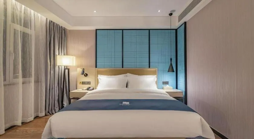 Bed in Echarm Hotel Tai'an Taishan Tianwai Village Hongmen