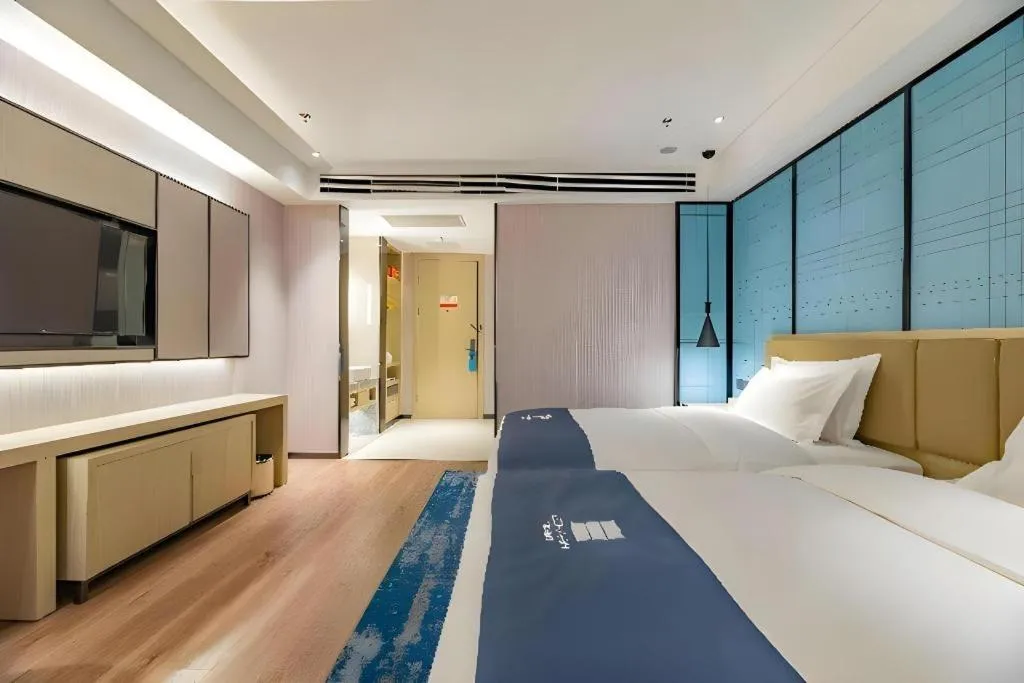 Bed in Echarm Hotel Tai'an Taishan Tianwai Village Hongmen