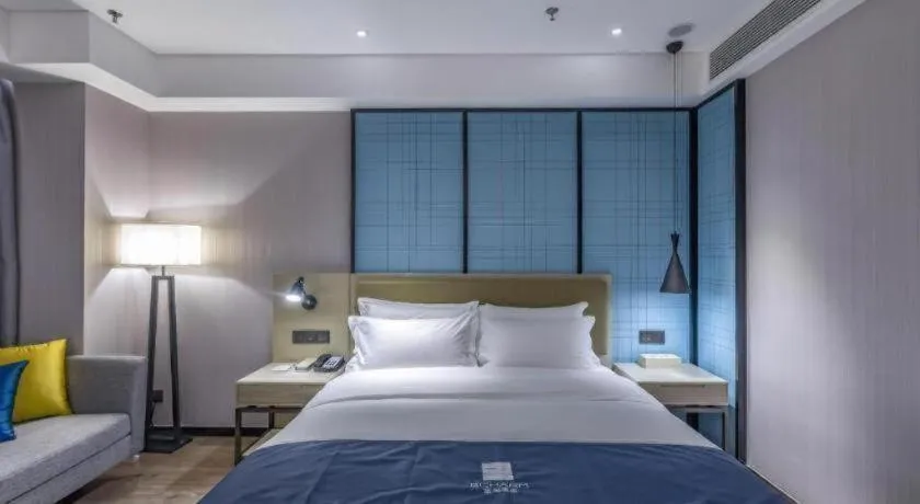 Bed in Echarm Hotel Tai'an Taishan Tianwai Village Hongmen