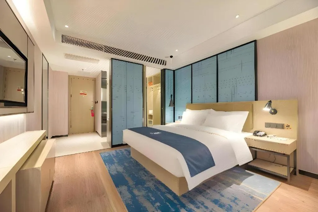 Bed in Echarm Hotel Tai'an Taishan Tianwai Village Hongmen