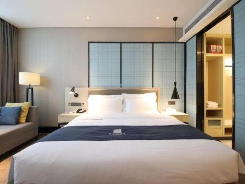 Bed in Echarm Hotel Tai'an Taishan Tianwai Village Hongmen