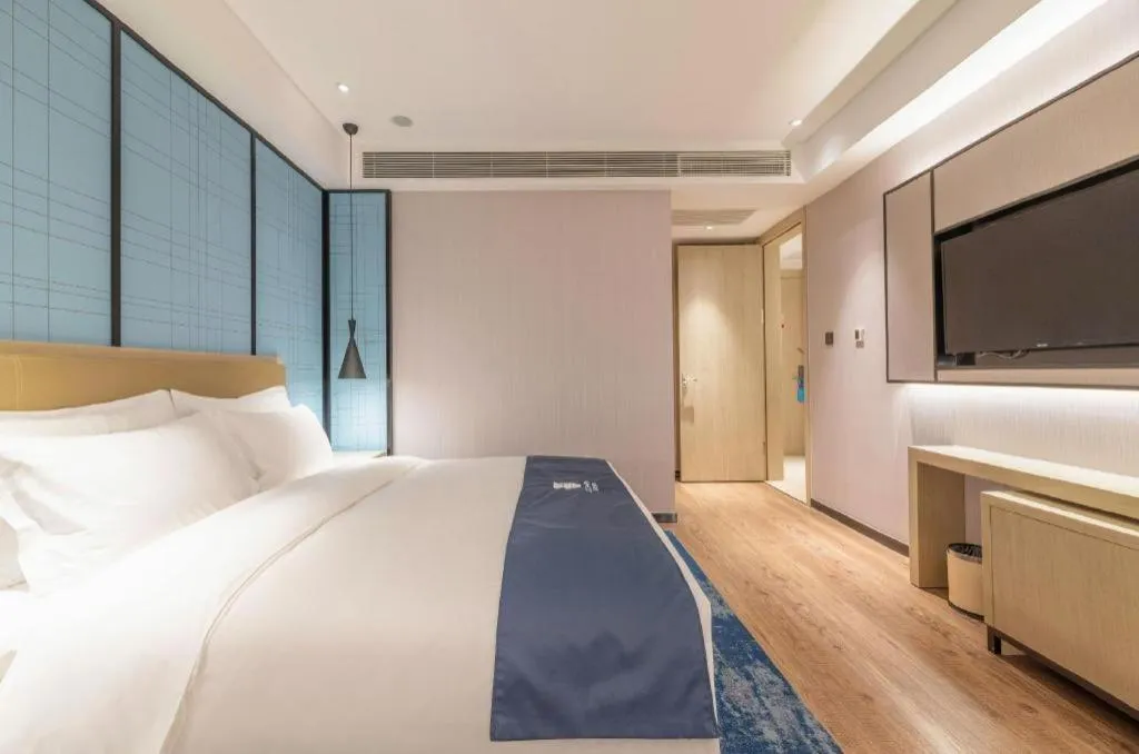 Bed in Echarm Hotel Tai'an Taishan Tianwai Village Hongmen