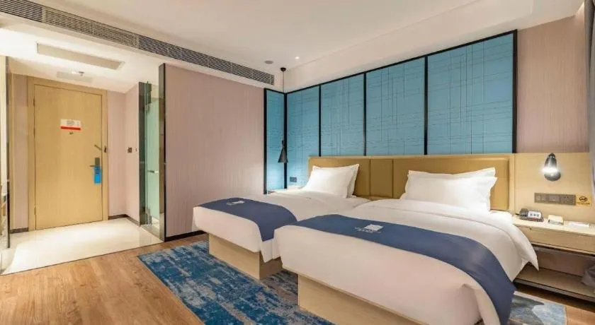 Bed in Echarm Hotel Tai'an Taishan Tianwai Village Hongmen