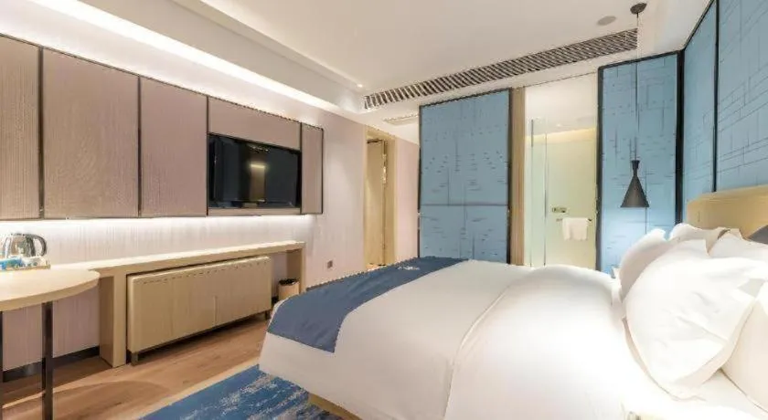 Bed in Echarm Hotel Tai'an Taishan Tianwai Village Hongmen