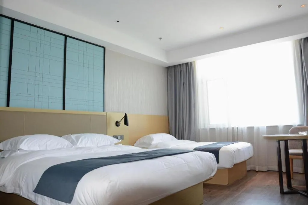 Bed in Echarm Hotel Tai'an Taishan Tianwai Village Hongmen