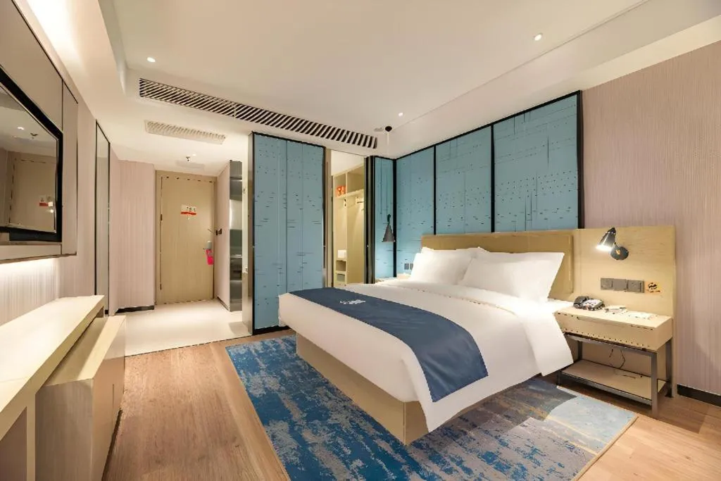 Bed in Echarm Hotel Tai'an Taishan Tianwai Village Hongmen