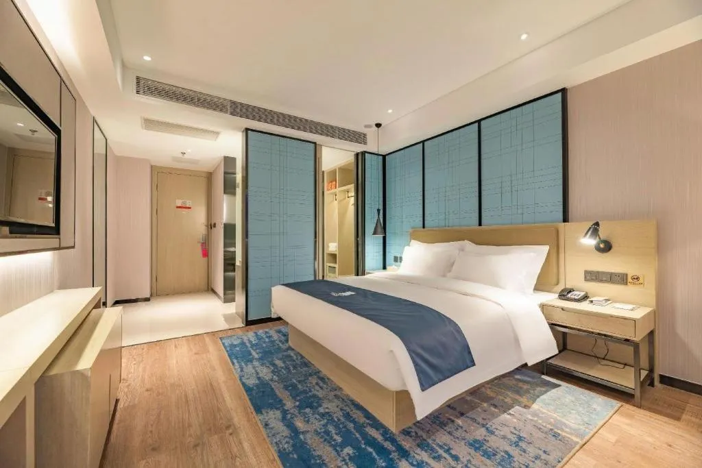 Bed in Echarm Hotel Tai'an Taishan Tianwai Village Hongmen