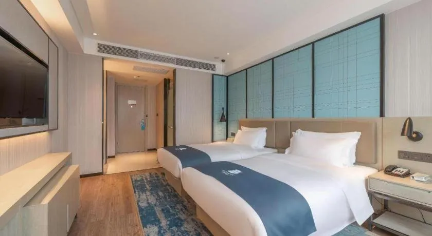 Bed in Echarm Hotel Tai'an Taishan Tianwai Village Hongmen