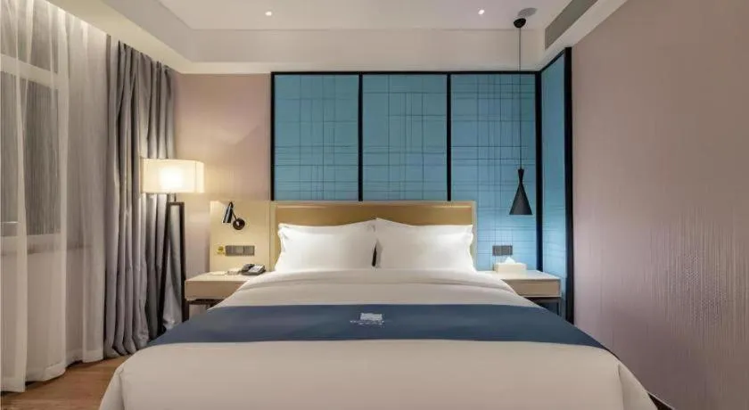 Bed in Echarm Hotel Tai'an Taishan Tianwai Village Hongmen