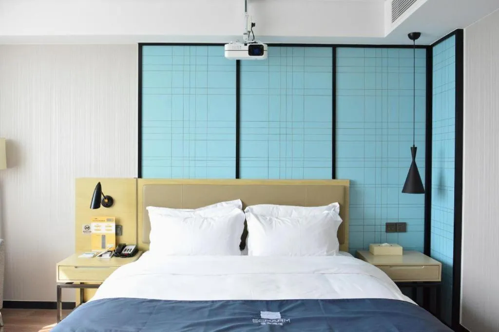 Bed in Echarm Hotel Tai'an Taishan Tianwai Village Hongmen