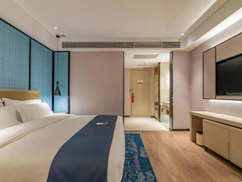 Bed in Echarm Hotel Tai'an Taishan Tianwai Village Hongmen