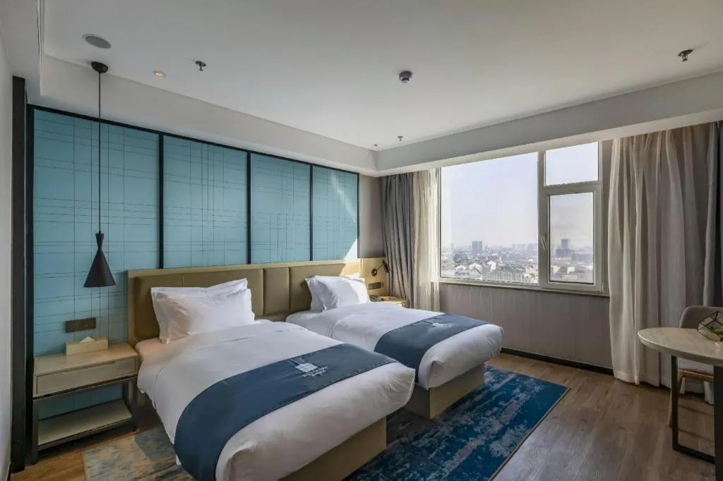 Bed in Echarm Hotel Tai'an Taishan Tianwai Village Hongmen