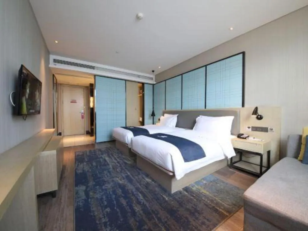 Bed in Echarm Hotel Tai'an Taishan Tianwai Village Hongmen