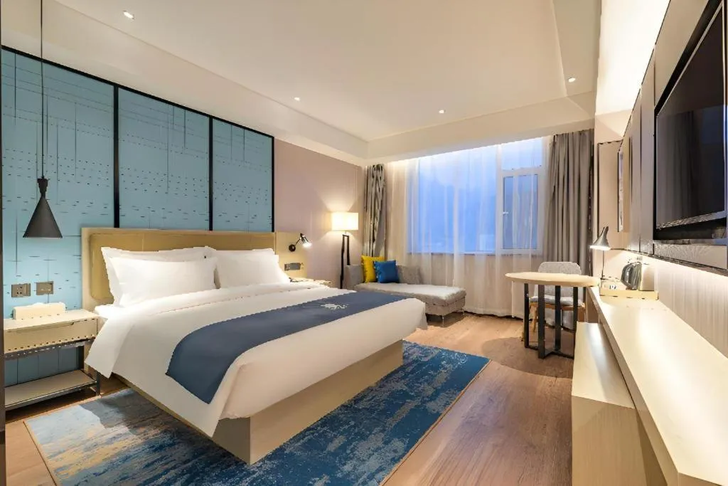 Bed in Echarm Hotel Tai'an Taishan Tianwai Village Hongmen