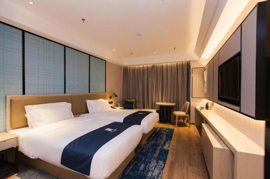 Bed in Echarm Hotel Tai'an Taishan Tianwai Village Hongmen