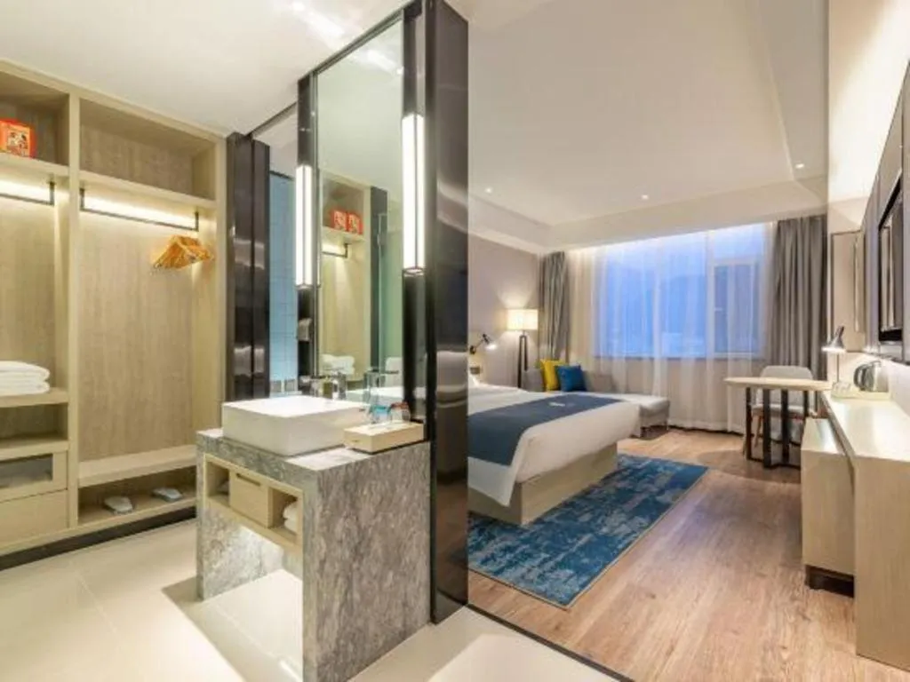 Bed in Echarm Hotel Tai'an Taishan Tianwai Village Hongmen