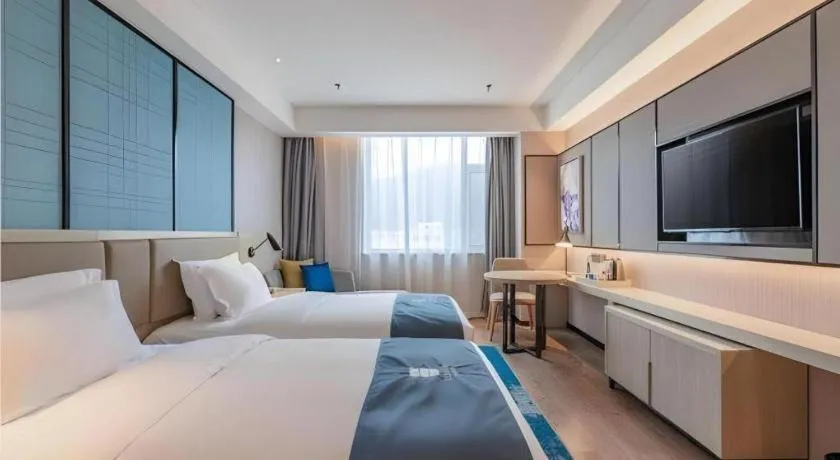 Bed in Echarm Hotel Tai'an Taishan Tianwai Village Hongmen