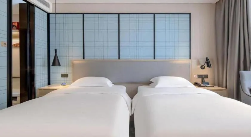 Bed in Echarm Hotel Nanning Dongge Macun Metro Station